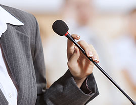 person speaking on a mic