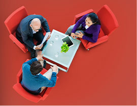 three people in a meeting