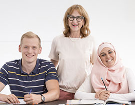 Two female and a male smiling